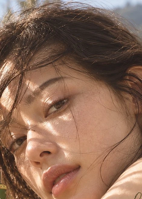 Model with dewy skin in sunlight
